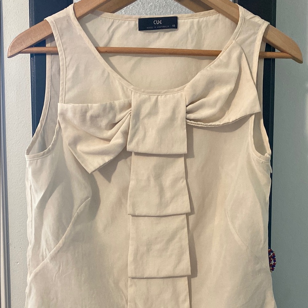 Cue Cream Sleeveless Ruffled Blouse with Asymmetrical Bow Front